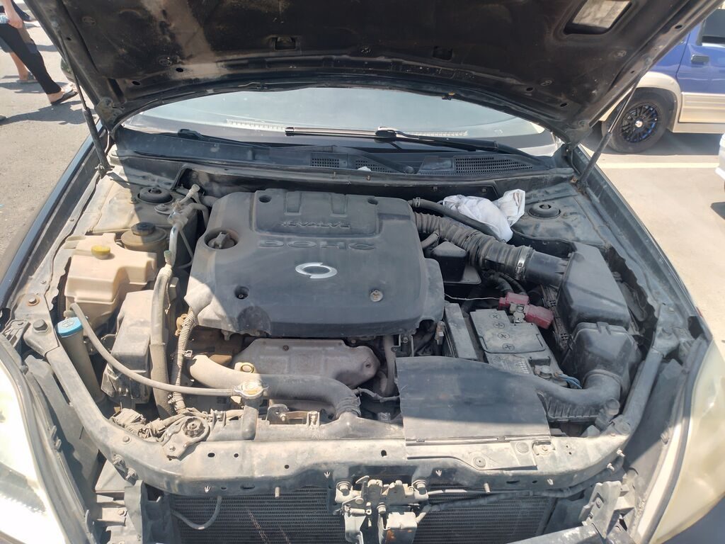 Nissan Teana I (J31), черный седан бизнес-класса. Основные