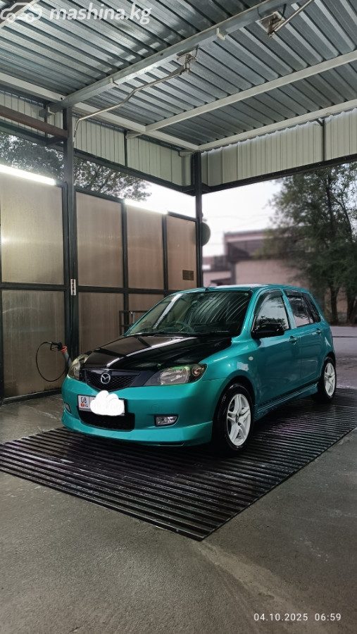 Mazda Demio II (DY)